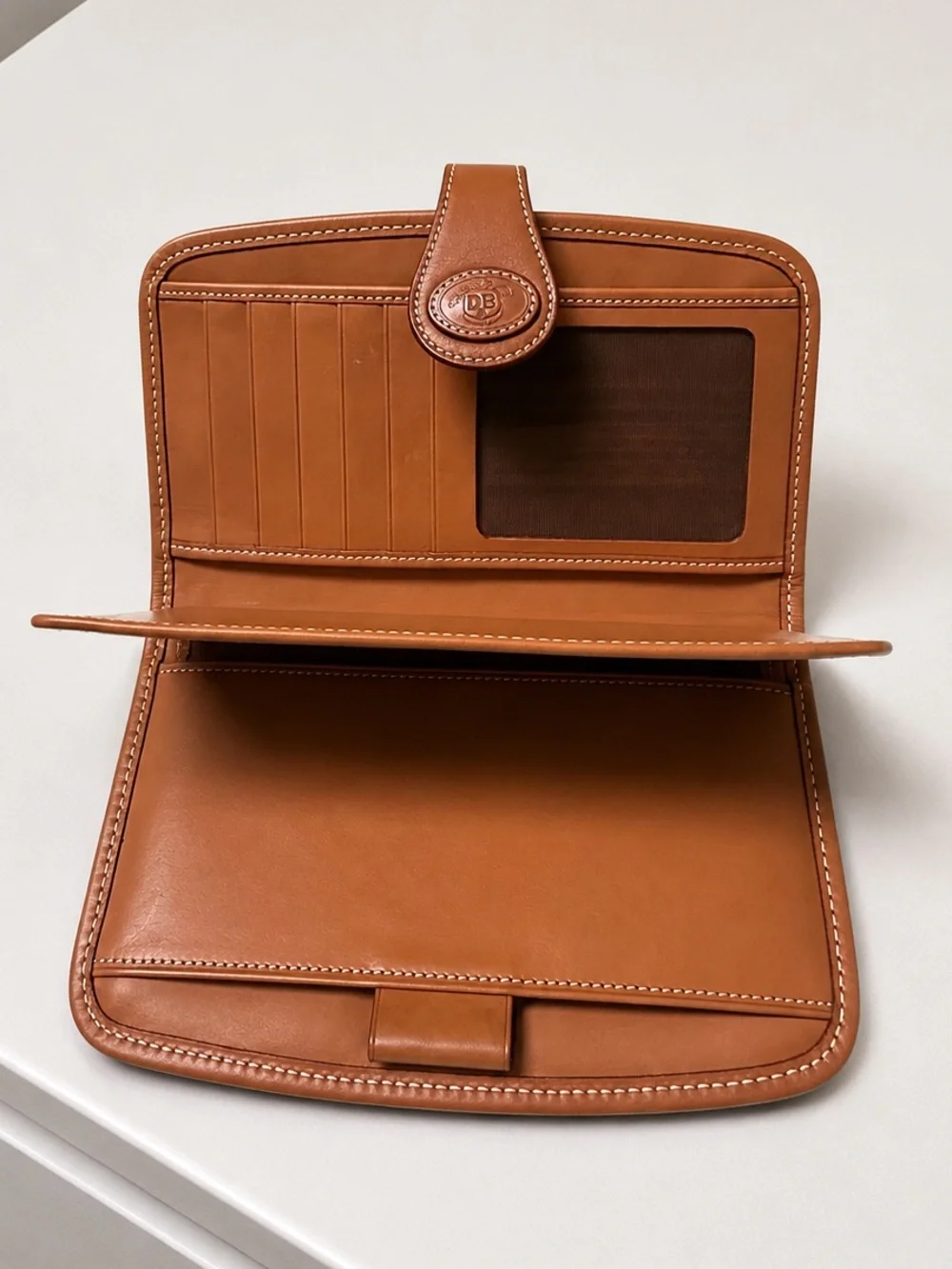 Authentic vintage Dooney & Bourke bifold continental checkbook wallet.